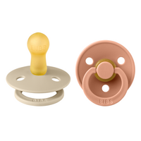 set-2-suzete-cu-tetina-rotunda-colour-latex-6-luni-vanilla-peach-bibs-2183.png