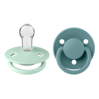 set-2-suzete-cu-tetina-rotunda-din-silicon-universala-de-lux-0-3-ani-nordic-mint-island-sea-bibs-7432.png